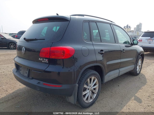 WVGJV3AX0EW573435 Volkswagen Tiguan