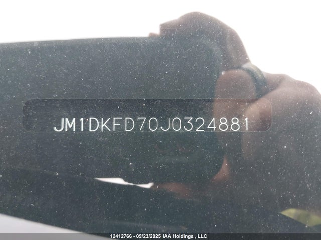 JM1DKFD70J0324881 Mazda pe