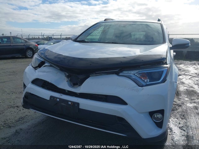 JTMRJREV7JD174493 Toyota Rav4 Hybrid Le+