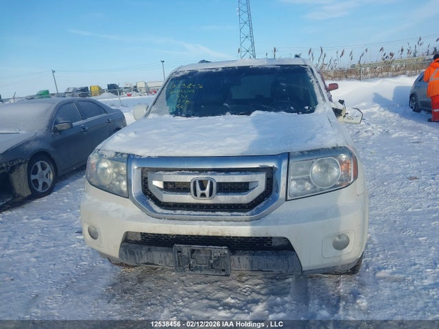12538456 :رقم المزاد ، 5FNYF4H97BB502102 vin ، 2011 Honda Pilot Touring مزاد بيع