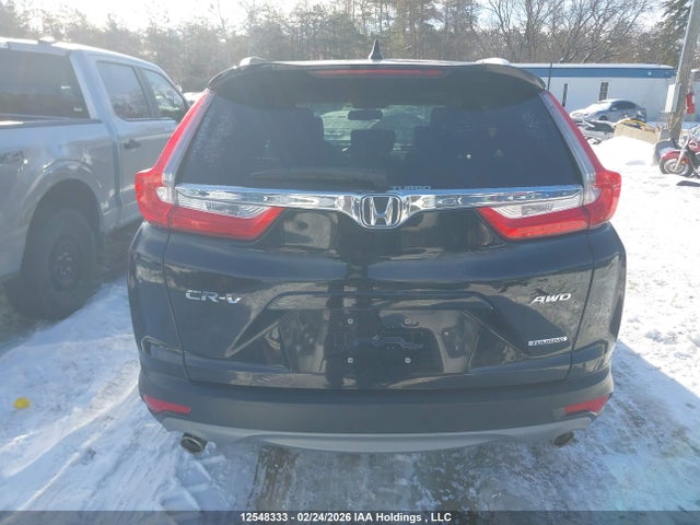 12548333 :رقم المزاد ، 2HKRW2H99KH114623 vin ، 2019 Honda Cr-v Touring مزاد بيع