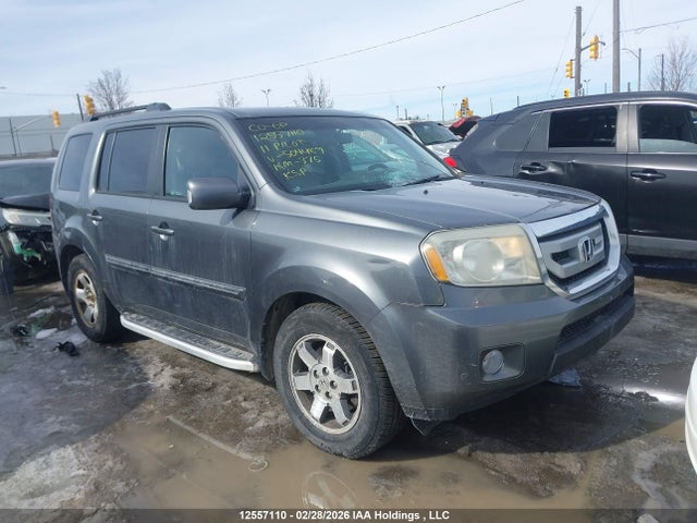 12557110 :رقم المزاد ، 5FNYF4H91BB504489 vin ، 2011 Honda Pilot Touring مزاد بيع