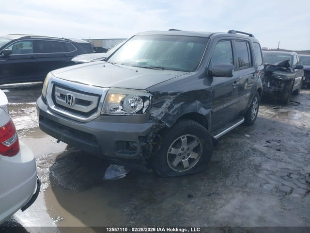 12557110 :رقم المزاد ، 5FNYF4H91BB504489 vin ، 2011 Honda Pilot Touring مزاد بيع