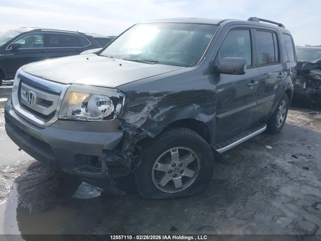 12557110 :رقم المزاد ، 5FNYF4H91BB504489 vin ، 2011 Honda Pilot Touring مزاد بيع