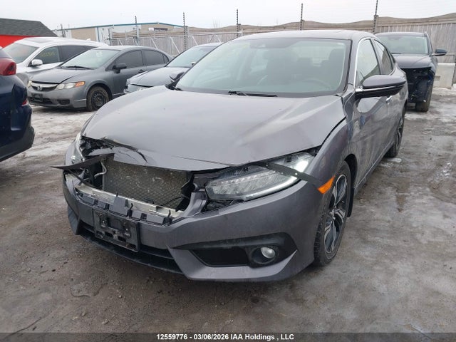 2017 Honda Civic Touring მანქანა იყიდება აუქციონზე, vin: 2HGFC1F99HH101074, აუქციონის ნომერი: 12559776