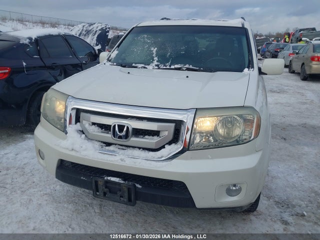 12516672 :رقم المزاد ، 5FNYF4H94BB501568 vin ، 2011 Honda Pilot Touring مزاد بيع