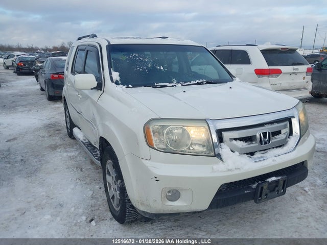 12516672 :رقم المزاد ، 5FNYF4H94BB501568 vin ، 2011 Honda Pilot Touring مزاد بيع