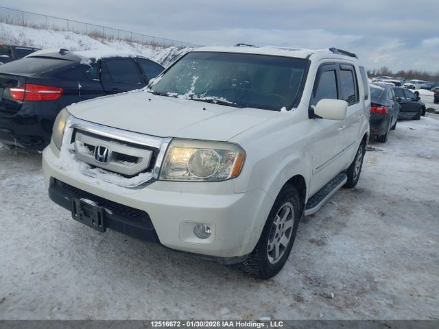12516672 :رقم المزاد ، 5FNYF4H94BB501568 vin ، 2011 Honda Pilot Touring مزاد بيع