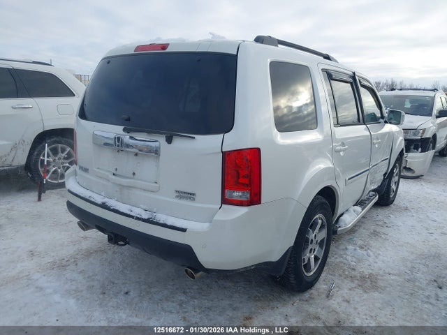 12516672 :رقم المزاد ، 5FNYF4H94BB501568 vin ، 2011 Honda Pilot Touring مزاد بيع