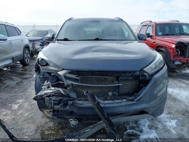 KM8J3CA26HU411898 Hyundai TUCSON SE