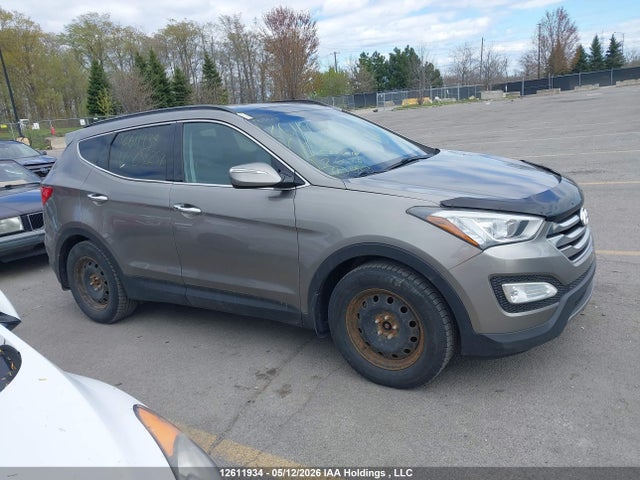 12611934 :رقم المزاد ، 5XYZUDLA6FG258257 vin ، 2015 Hyundai Santa Fe مزاد بيع