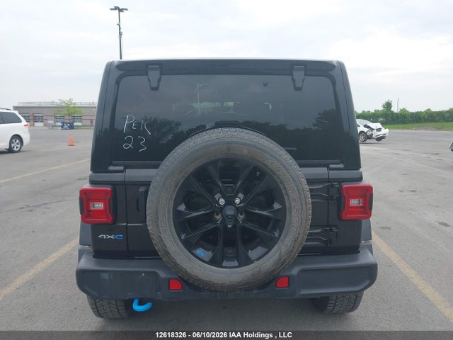 12618326 :رقم المزاد ، 1C4JJXP68PW670097 vin ، 2023 Jeep Wrangler 4xe Unlimited Sahara مزاد بيع