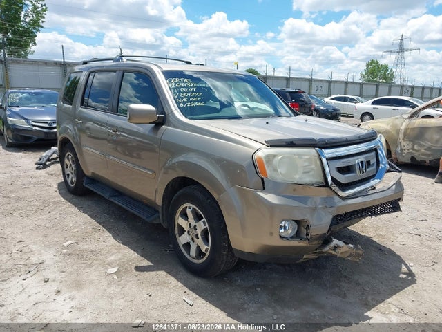 2011 Honda Pilot Touring მანქანა იყიდება აუქციონზე, vin: 5FNYF4H9XBB501297, აუქციონის ნომერი: 12641371