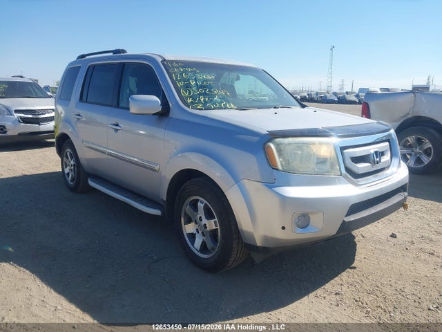 2010 Honda Pilot Touring მანქანა იყიდება აუქციონზე, vin: 5FNYF4H94AB502847, აუქციონის ნომერი: 12653450