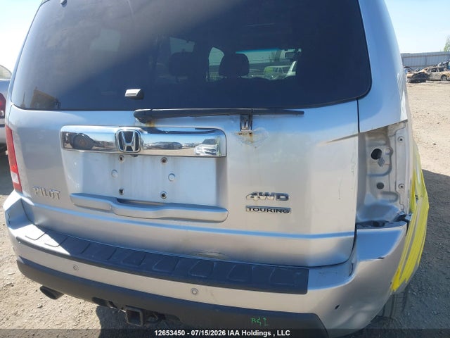 2010 Honda Pilot Touring მანქანა იყიდება აუქციონზე, vin: 5FNYF4H94AB502847, აუქციონის ნომერი: 12653450