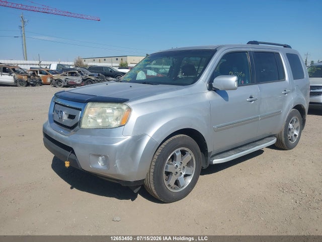 2010 Honda Pilot Touring მანქანა იყიდება აუქციონზე, vin: 5FNYF4H94AB502847, აუქციონის ნომერი: 12653450