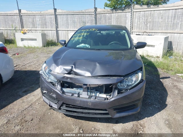 12666534 :رقم المزاد ، 2HGFC2F52JH036111 vin ، 2018 Honda Civic Lx مزاد بيع