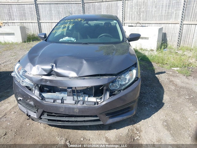 12666534 :رقم المزاد ، 2HGFC2F52JH036111 vin ، 2018 Honda Civic Lx مزاد بيع