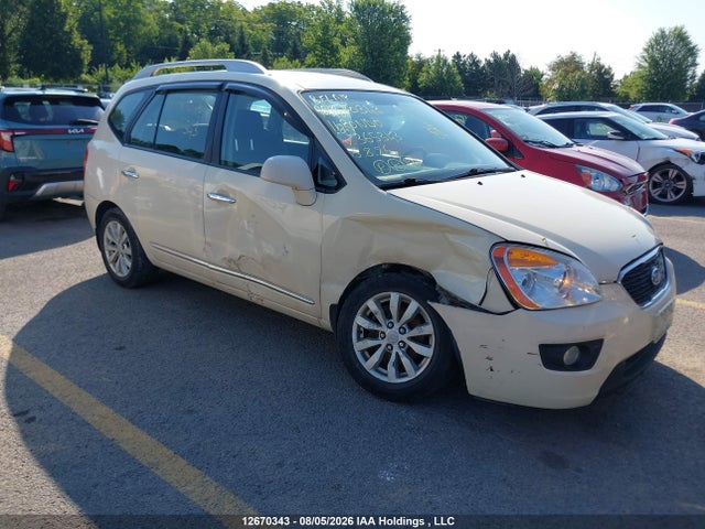 12670343 :رقم المزاد ، KNAHH8C69B7365343 vin ، 2011 Kia Rondo مزاد بيع