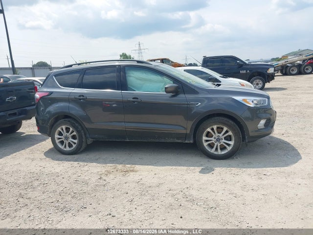 Продажа на аукционе авто 2018 Ford Escape, vin: 1FMCU9HD7JUC63816, номер лота: 12673333