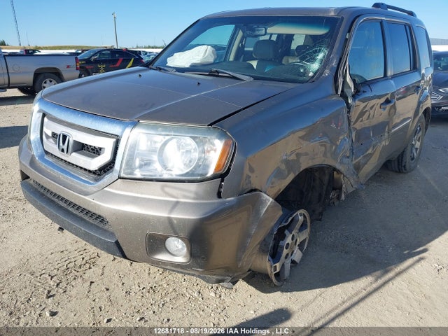 12681718 :رقم المزاد ، 5FNYF4H91BB503519 vin ، 2011 Honda Pilot Touring مزاد بيع