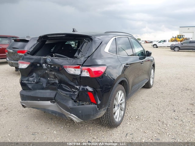 2021 Ford Escape Titanium Hybrid მანქანა იყიდება აუქციონზე, vin: 1FMCU9DZXMUA58898, აუქციონის ნომერი: 12675144