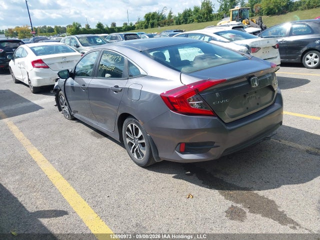 2HGFC2F57GH006059 Honda Civic Lx
