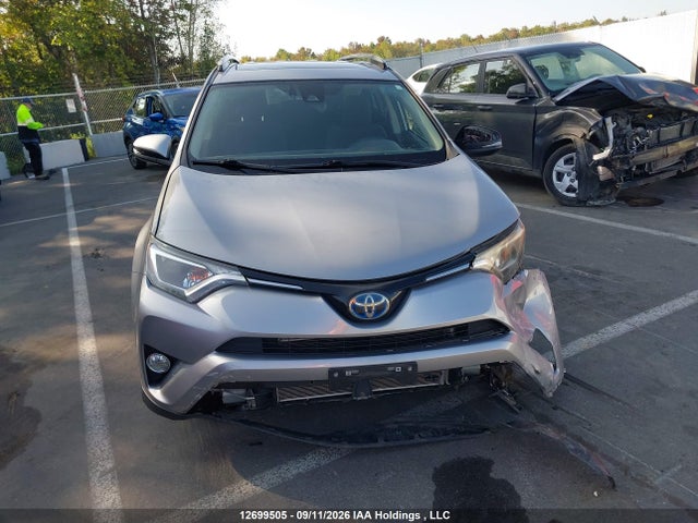 12699505 :رقم المزاد ، JTMRJREV6JD211808 vin ، 2018 Toyota Rav4 Hv Le Plus/xle مزاد بيع