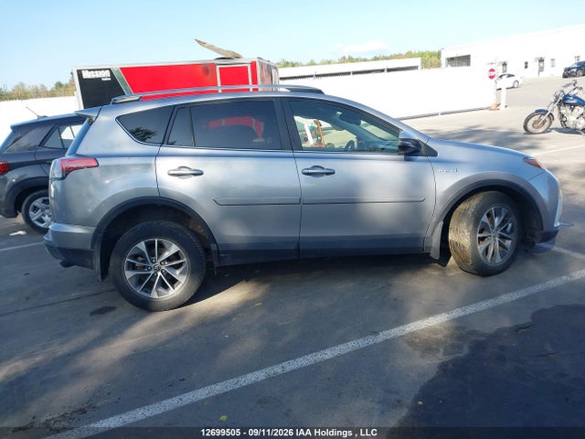 12699505 :رقم المزاد ، JTMRJREV6JD211808 vin ، 2018 Toyota Rav4 Hv Le Plus/xle مزاد بيع