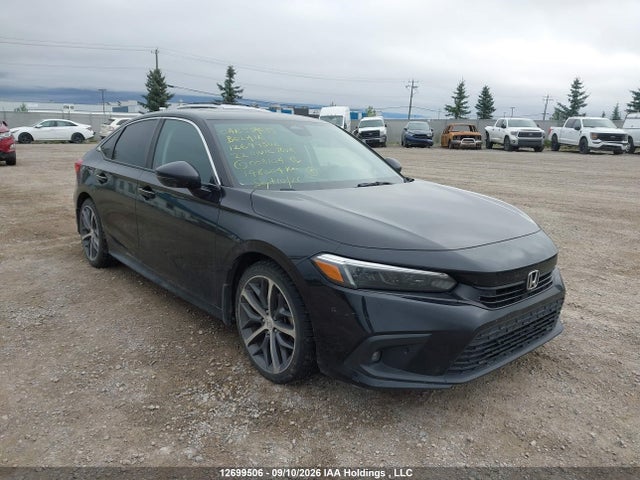 Auction sale of the 2022 Honda Civic Touring, vin: 2HGFE1F99NH003104, lot number: 12699506