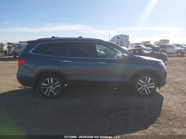 Продажа на аукционе авто 2017 Honda Pilot Touring, vin: 5FNYF6H92HB505784, номер лота: 12710466
