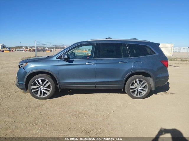 Продажа на аукционе авто 2017 Honda Pilot Touring, vin: 5FNYF6H92HB505784, номер лота: 12710466