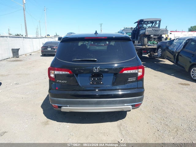 12710631 :رقم المزاد ، 5FNYF6H90MB501033 vin ، 2021 Honda Pilot Touring 8p مزاد بيع
