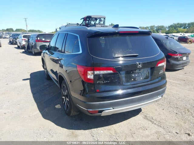 12710631 :رقم المزاد ، 5FNYF6H90MB501033 vin ، 2021 Honda Pilot Touring 8p مزاد بيع