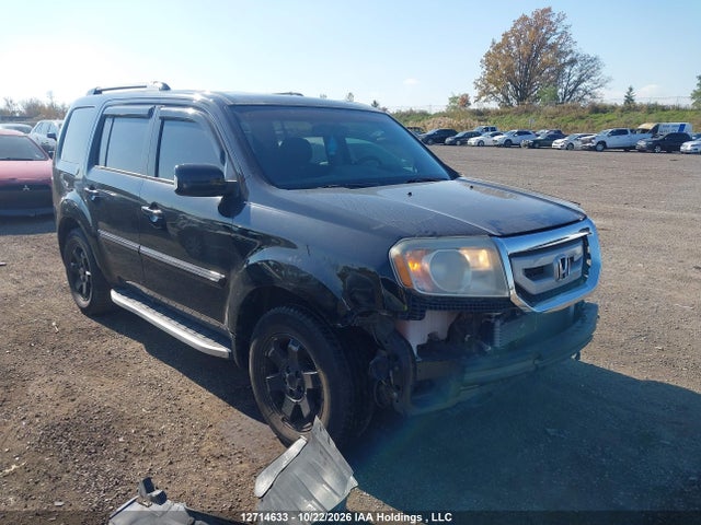 12714633 :رقم المزاد ، 5FNYF4H97BB505792 vin ، 2011 Honda Pilot Touring مزاد بيع