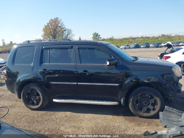 12714633 :رقم المزاد ، 5FNYF4H97BB505792 vin ، 2011 Honda Pilot Touring مزاد بيع