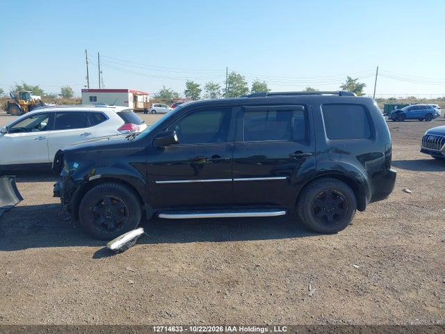 12714633 :رقم المزاد ، 5FNYF4H97BB505792 vin ، 2011 Honda Pilot Touring مزاد بيع