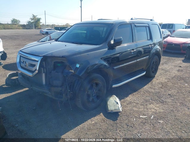 12714633 :رقم المزاد ، 5FNYF4H97BB505792 vin ، 2011 Honda Pilot Touring مزاد بيع