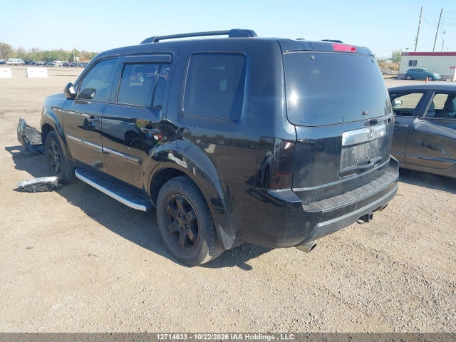 12714633 :رقم المزاد ، 5FNYF4H97BB505792 vin ، 2011 Honda Pilot Touring مزاد بيع