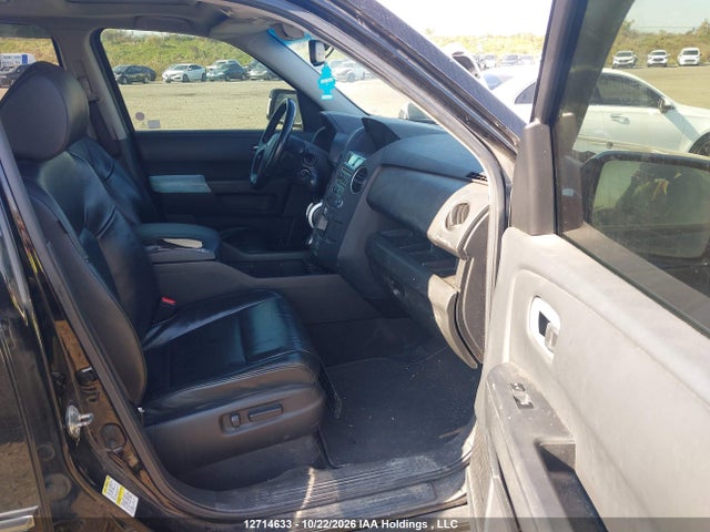 12714633 :رقم المزاد ، 5FNYF4H97BB505792 vin ، 2011 Honda Pilot Touring مزاد بيع