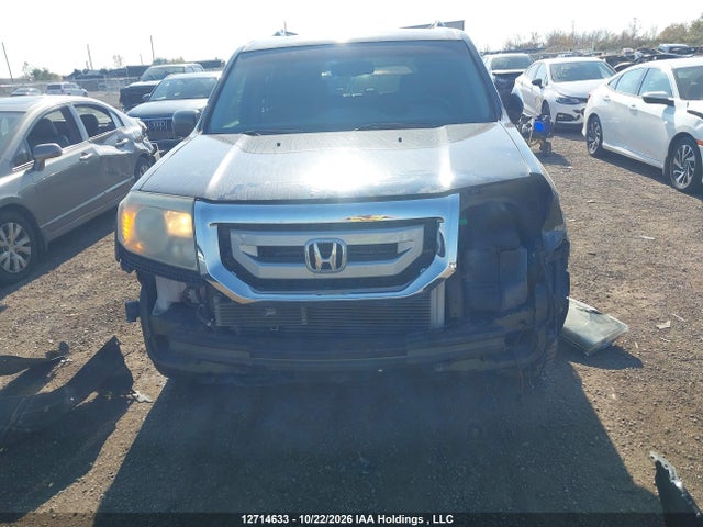 12714633 :رقم المزاد ، 5FNYF4H97BB505792 vin ، 2011 Honda Pilot Touring مزاد بيع