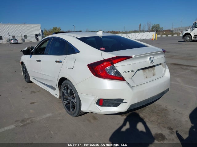 Auction sale of the 2017 Honda Civic Touring, vin: 2HGFC1F92HH106147, lot number: 12731187