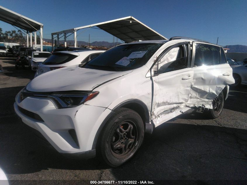 VIN JTMZFREV9JD122817 2018 TOYOTA RAV4 LE