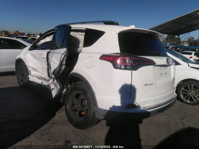VIN JTMZFREV9JD122817 2018 TOYOTA RAV4 LE