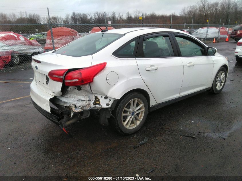 VIN 1FADP3F20JL213799 2018 FORD FOCUS SE