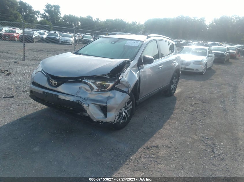 VIN JTMBFREV6JJ217953 2018 TOYOTA RAV4 LE