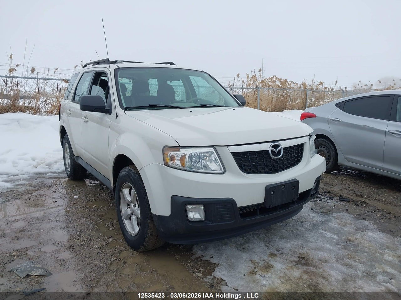 4F2CY0GG2BKM03428 · 2011 MAZDA TRIBUTE S