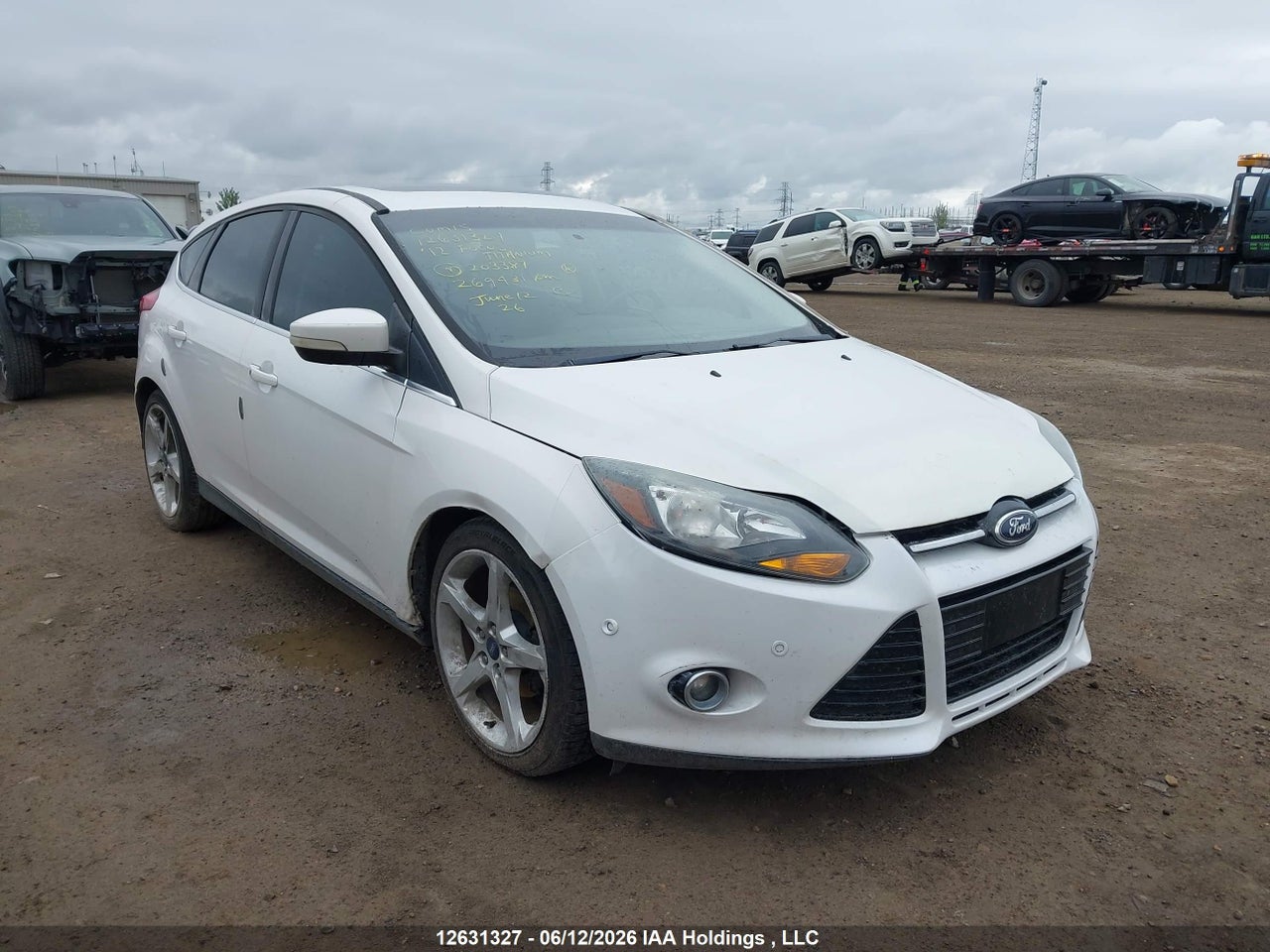1FAHP3N27CL203387 · 2012 FORD FOCUS TITANIUM · 1/12