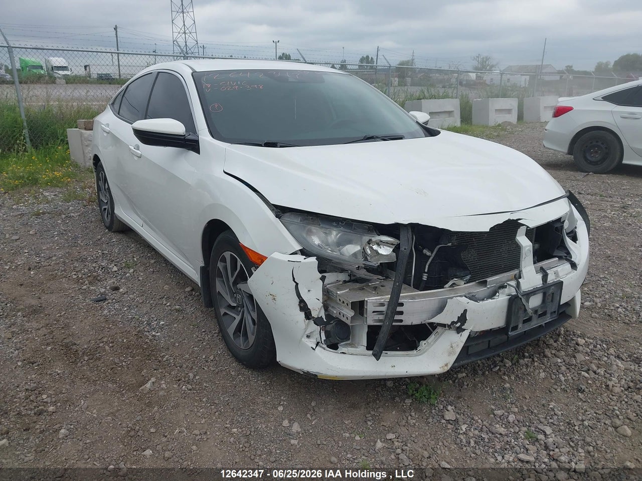 2HGFC2F61JH029398 · 2018 HONDA CIVIC SE