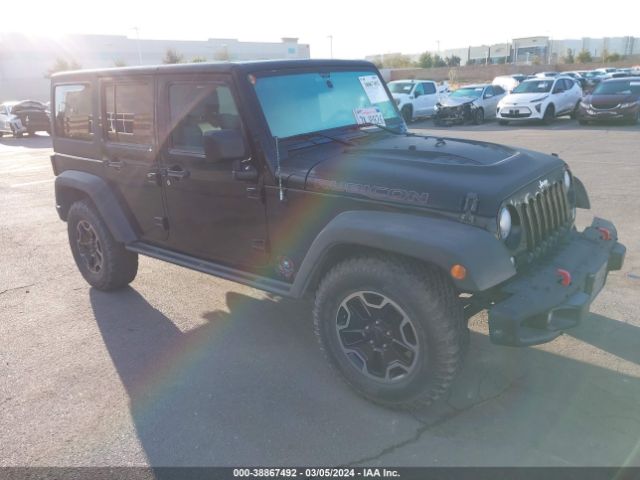 Auction sale of the 2015 Jeep Wrangler Unlimited Rubicon Hard Rock, vin: 1C4HJWFG5FL644043, lot number: 38867492